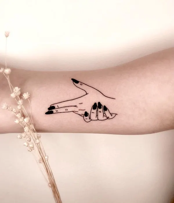 Hand gun gesture tattoo on the inner arm by @ladnie.ink- Stunning Badass Tattoos For Women