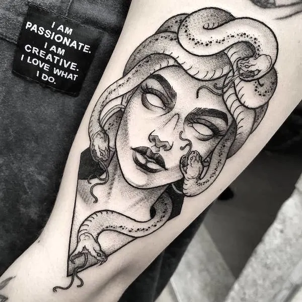 A detailed Medusa tattoo by @irisblacktattoo