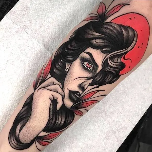 A mysterious portrait tattoo with contrasting colors by @sebastianblack_tattoo
