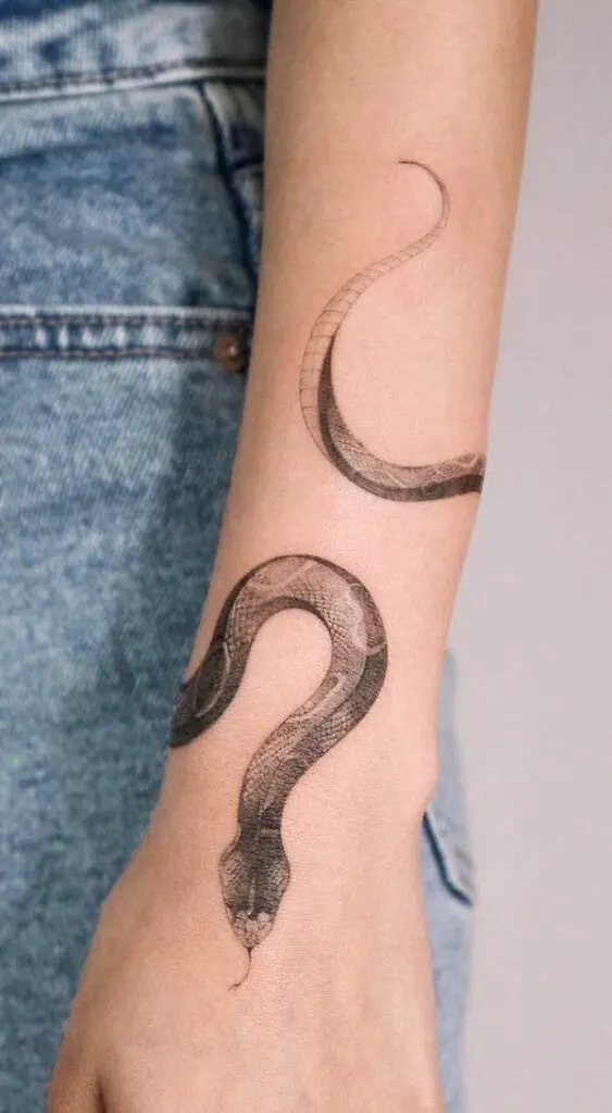 Snake forearm tattoo by @choseung.tat