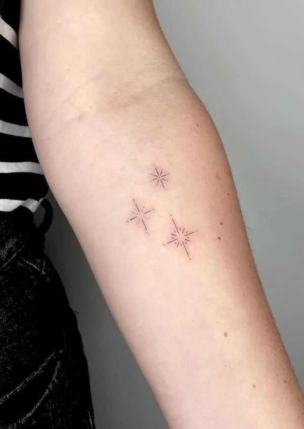 Star tattoos on the arm by @amylowdontattoo