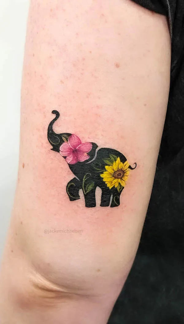 Tropical elephant arm tattoo by @jackemichaelsen.tattoo