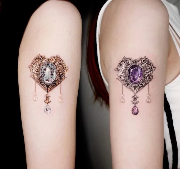 Matching gemstones twins tattoos by @tattooist_siia