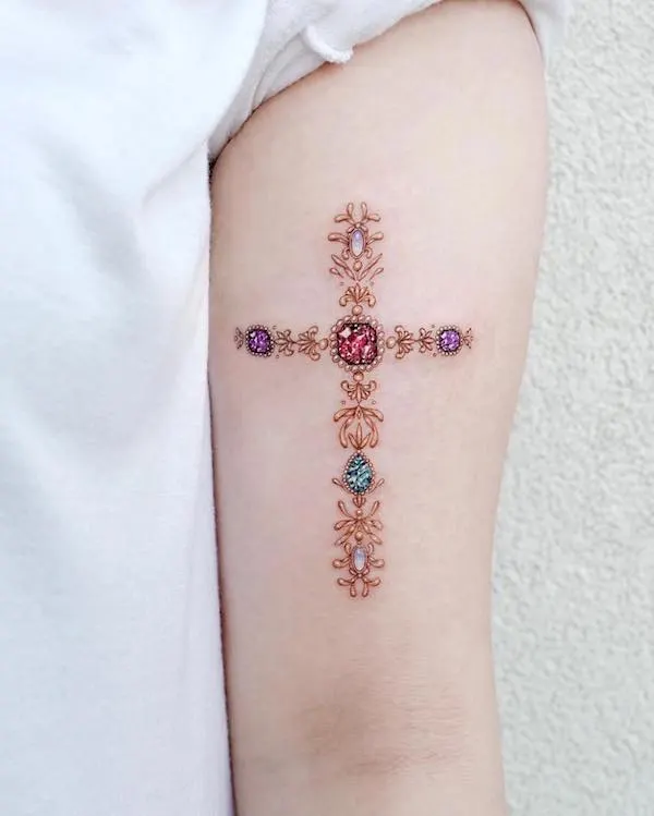 Gemstone cross arm tattoo by @tattooist_solar