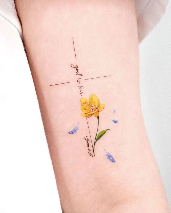 75 superbes tatouages de bras pour femmes avec signification 69 Cross with flower and quote by @tattooist_solar