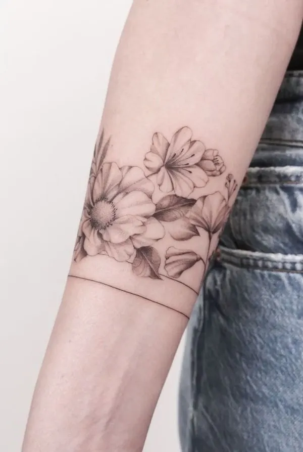 Black and grey flower bracelet by @amelie.tattooist