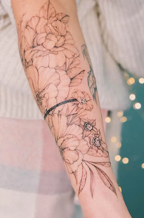 Floral bracelet forearm tattoo by @cathy.artwork
