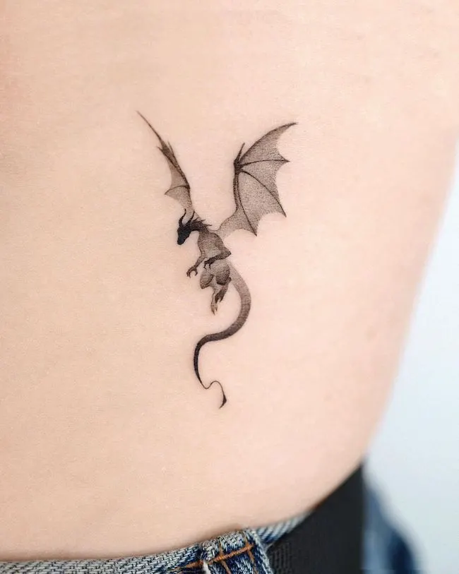 Small blackwork dragon tattoo by @choiyun_tattoo
