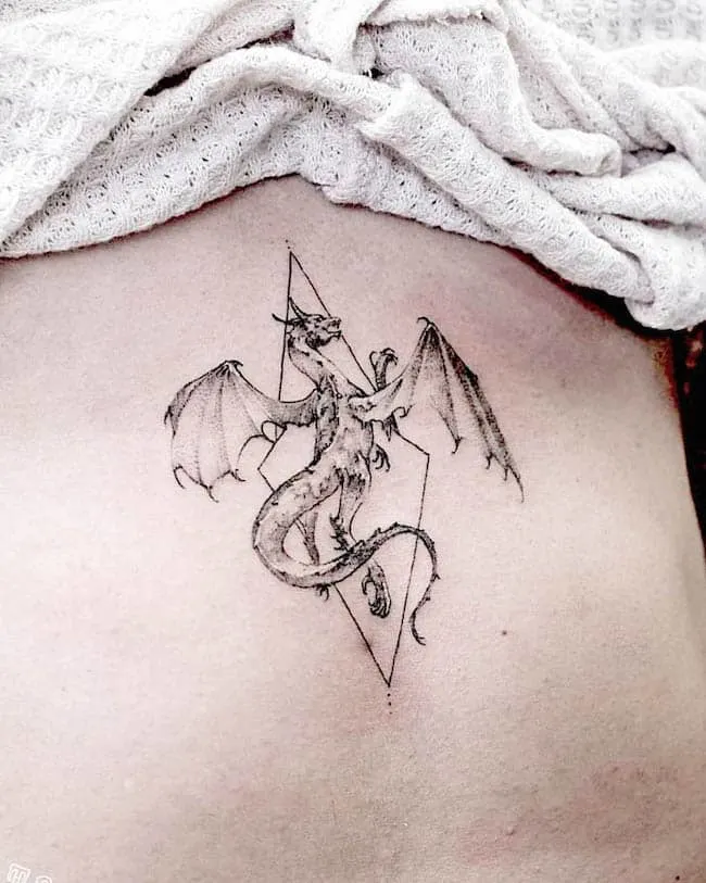 Triangle dragon tattoo by @patsarunink