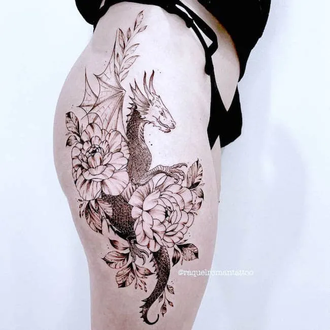 Detailed dragon thigh tattoo by @raquelromantattoo