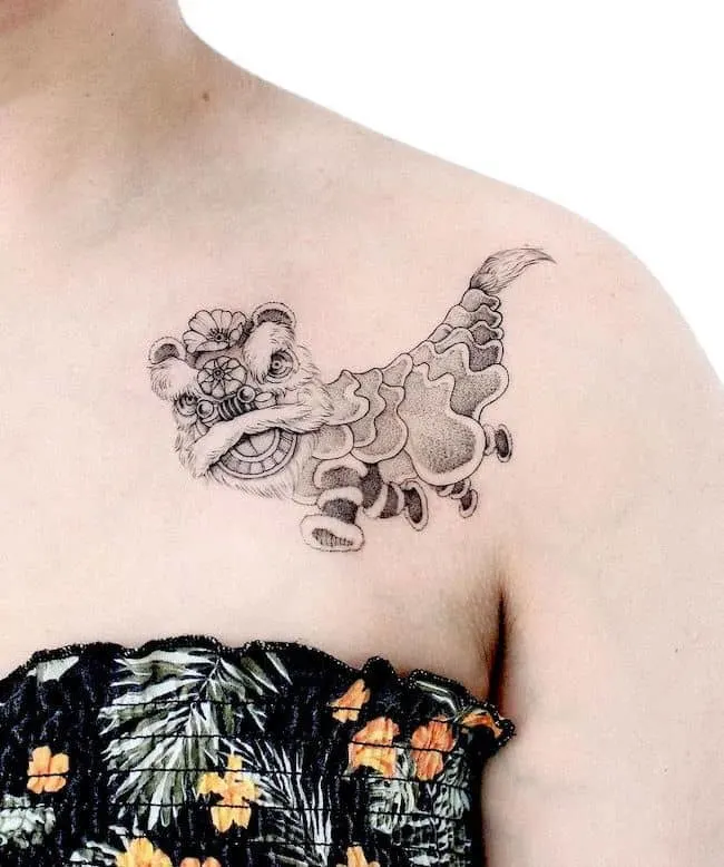 Chinese dragon collarbone tattoo for women by @poonkaros - best dragon tattoos for women and girls