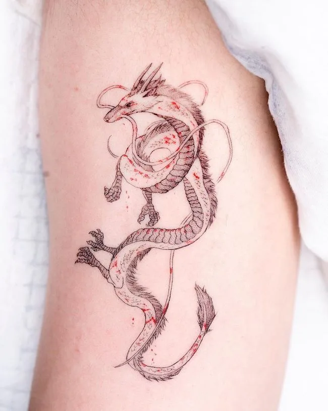 Blood and dragon tattoo by @oozy_tattoo