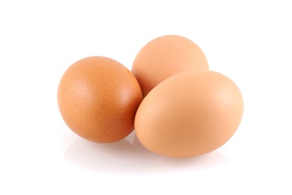 Three eggs, isolated on a white background.