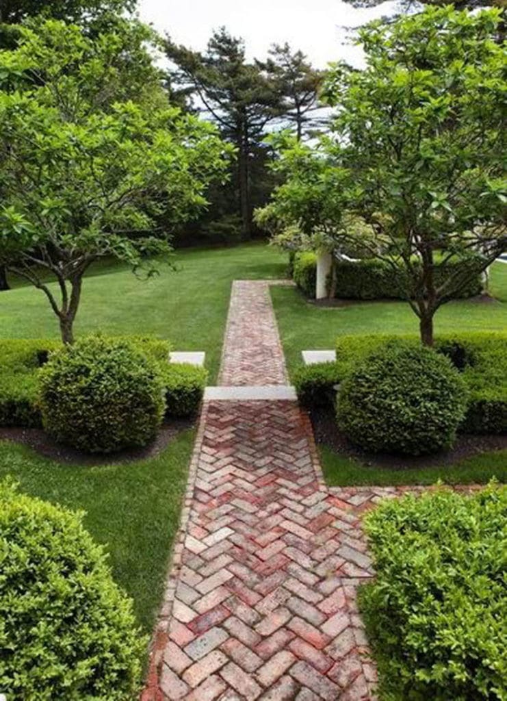 herringbone brick path in traditional garden design